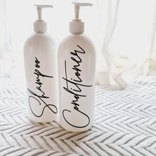Load image into Gallery viewer, White Pump bottles with black shampoo and conditioner labels. 
